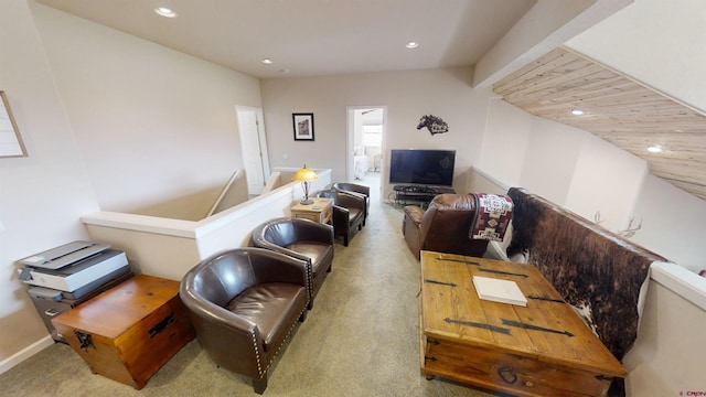 living room with vaulted ceiling and carpet floors