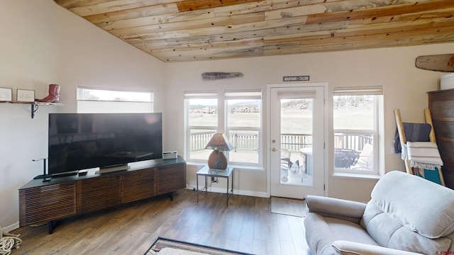 living room featuring a healthy amount of sunlight, wooden ceiling, hardwood / wood-style floors, and vaulted ceiling