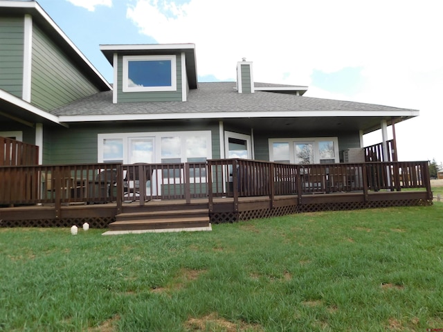 back of house with a yard and a wooden deck