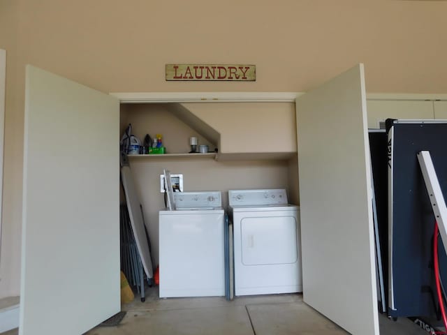 laundry room with hookup for a washing machine and separate washer and dryer