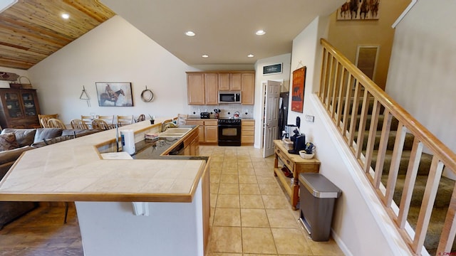 kitchen featuring backsplash, a breakfast bar area, black stove, lofted ceiling, and wood ceiling