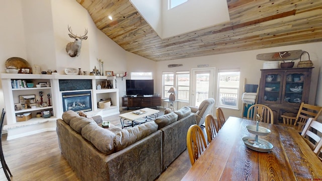 living room with hardwood / wood-style floors, wooden ceiling, vaulted ceiling, and built in shelves