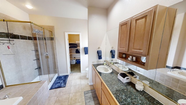 full bathroom featuring vanity, tile floors, toilet, and shower with separate bathtub