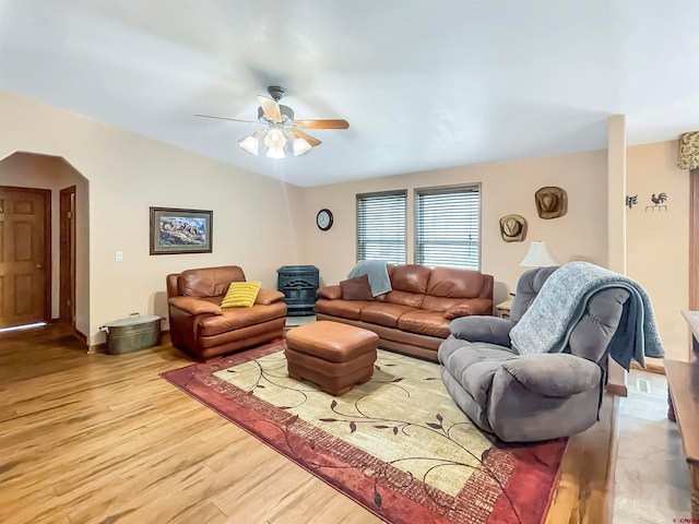 living room with ceiling fan, hardwood / wood-style floors, and lofted ceiling