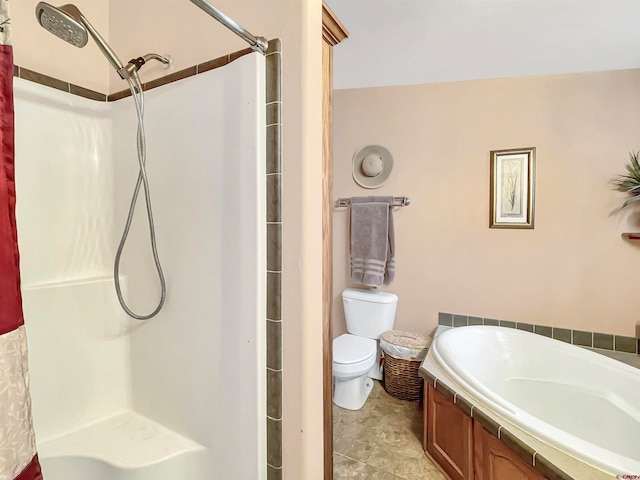 bathroom featuring tile floors and toilet