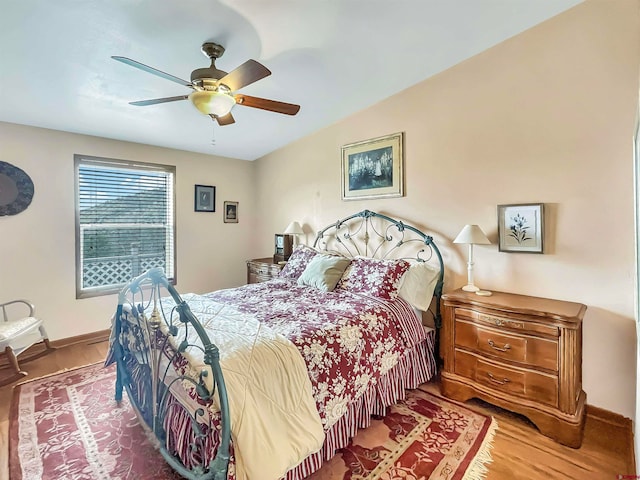 bedroom featuring hardwood / wood-style floors and ceiling fan