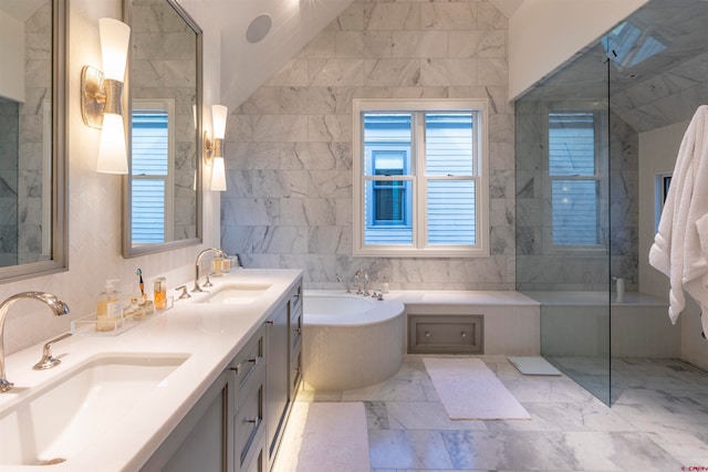 bathroom featuring tile walls, plus walk in shower, tile floors, dual bowl vanity, and lofted ceiling