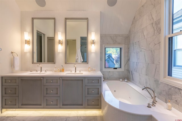 bathroom with vaulted ceiling, tile flooring, double sink vanity, and a bathing tub