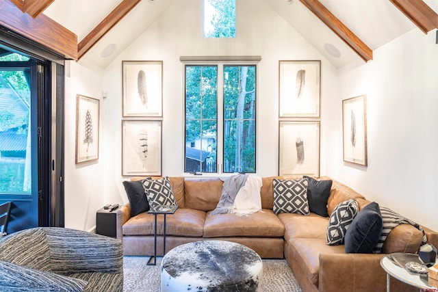 living room with high vaulted ceiling and beam ceiling