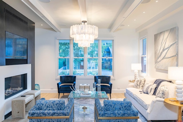 living room with beamed ceiling, a chandelier, and wood-type flooring