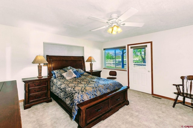 bedroom with light carpet and ceiling fan