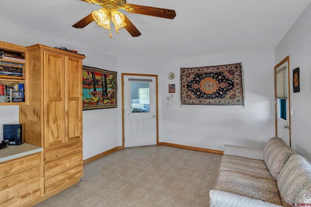 living room with ceiling fan and light tile floors