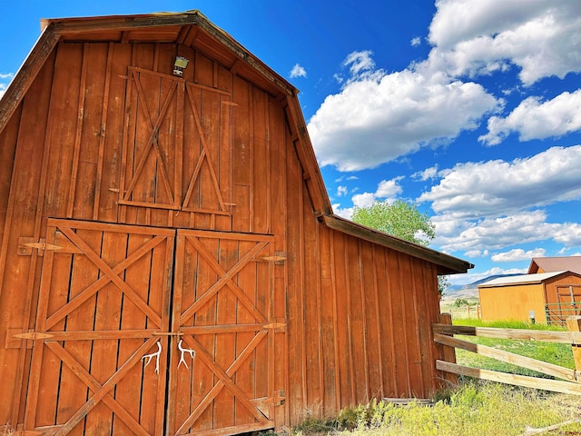 view of property exterior featuring an outdoor structure