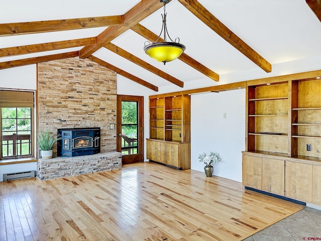 unfurnished living room with a baseboard heating unit, beamed ceiling, light hardwood / wood-style floors, and a wood stove