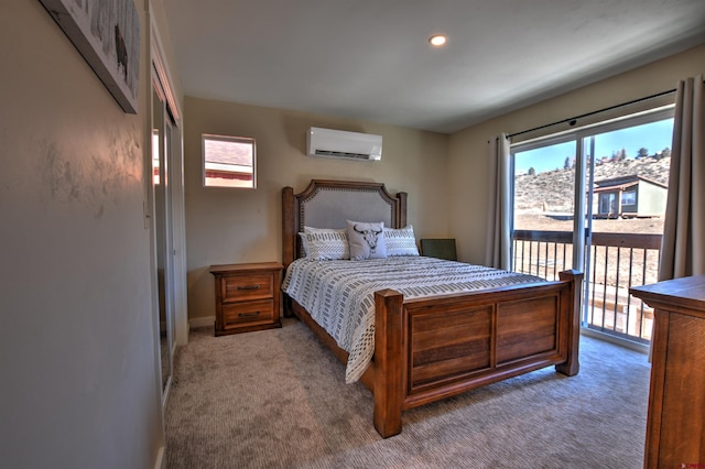 bedroom featuring access to outside, a wall unit AC, carpet, and recessed lighting