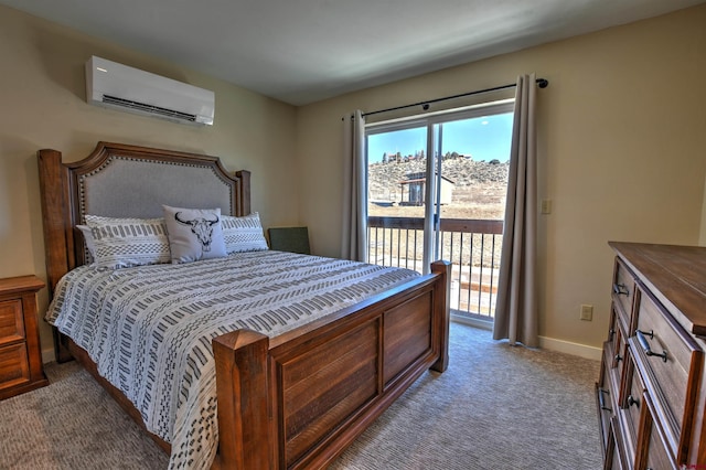 bedroom with a wall unit AC, access to outside, carpet floors, and baseboards