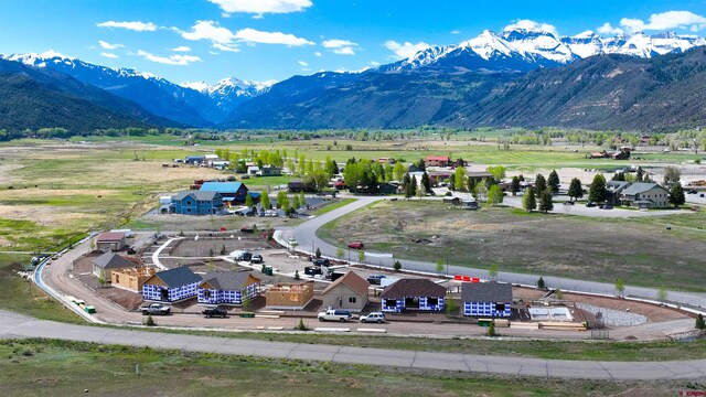 birds eye view of property with a mountain view