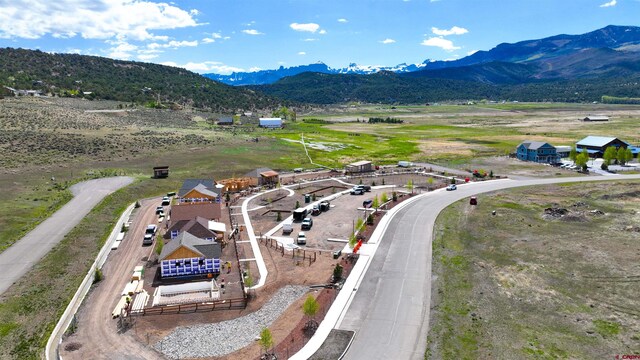 drone / aerial view featuring a rural view and a mountain view