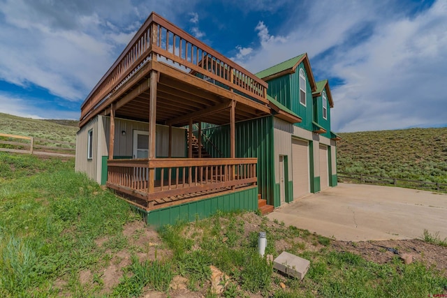 exterior space with a deck and a garage