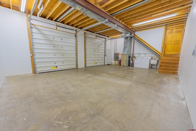 garage featuring washing machine and dryer