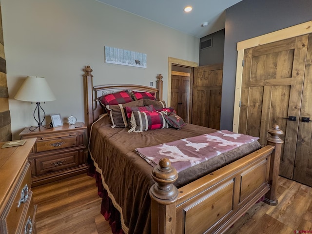 bedroom featuring wood-type flooring