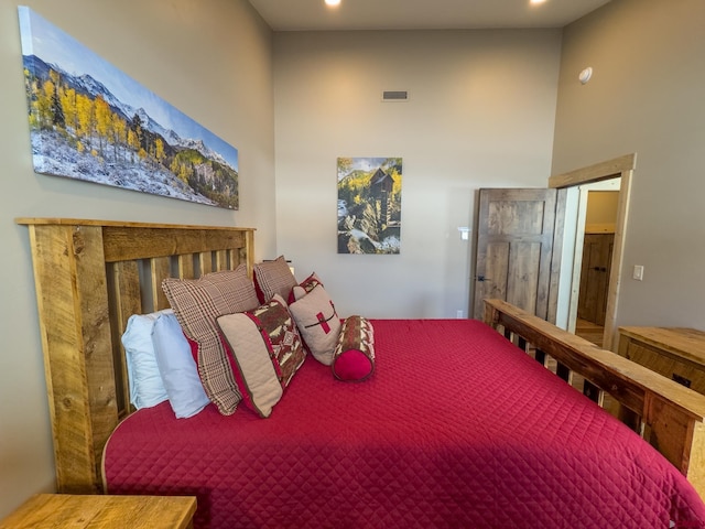 bedroom featuring a high ceiling