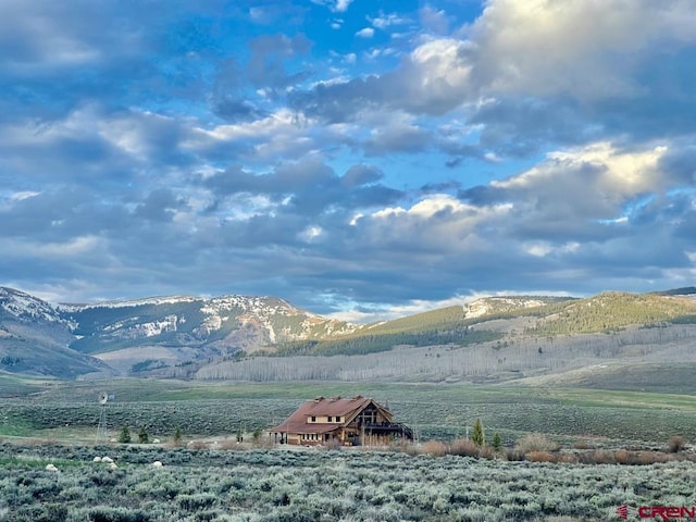 view of mountain feature with a rural view