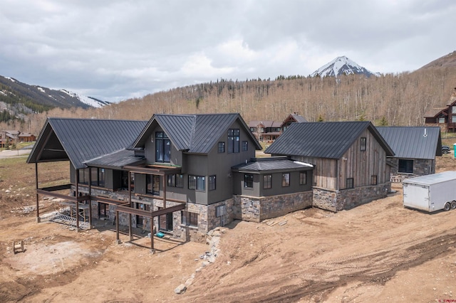 back of house featuring a mountain view