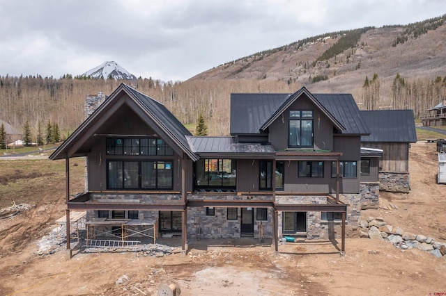 rear view of house with a mountain view