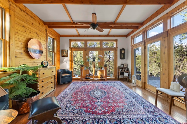 interior space with wood-type flooring, beamed ceiling, coffered ceiling, and ceiling fan