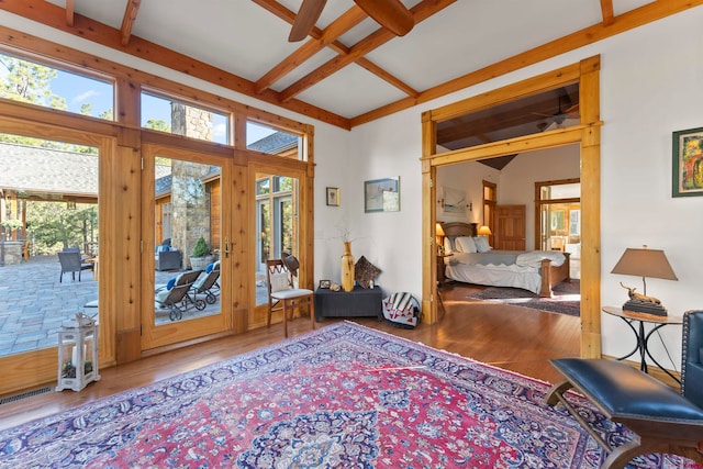 entrance foyer with a wealth of natural light, wood-type flooring, beamed ceiling, and coffered ceiling