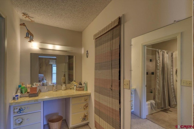 101 Spirit Path Ct, Pagosa Springs, CO 81147 - full bath featuring vanity, a textured ceiling, and shower / bath combination with curtain