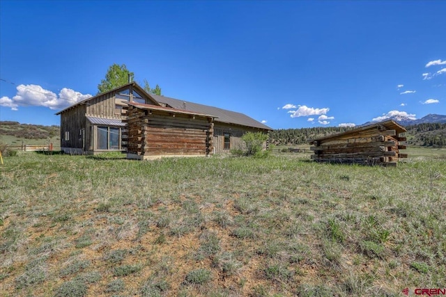 101 Spirit Path Ct, Pagosa Springs, CO 81147 - view of home's exterior featuring log siding and metal roof