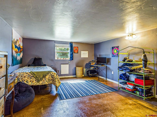 bedroom with concrete flooring