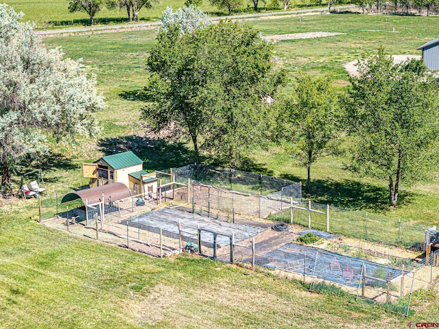 birds eye view of property with a rural view