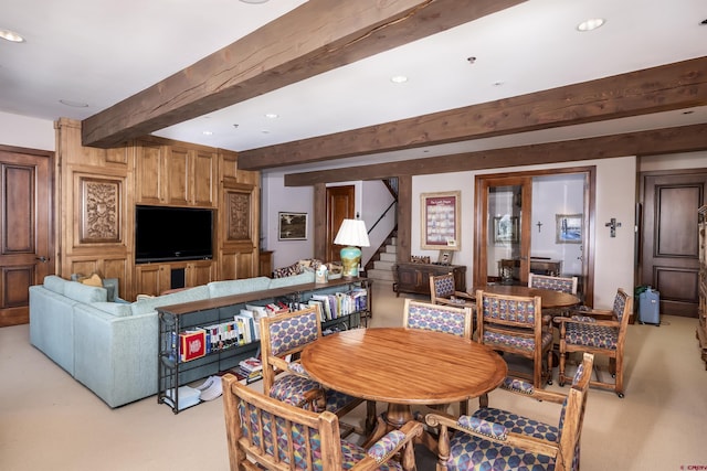 living room with beamed ceiling