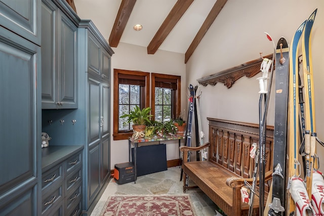 interior space with lofted ceiling with beams and light colored carpet