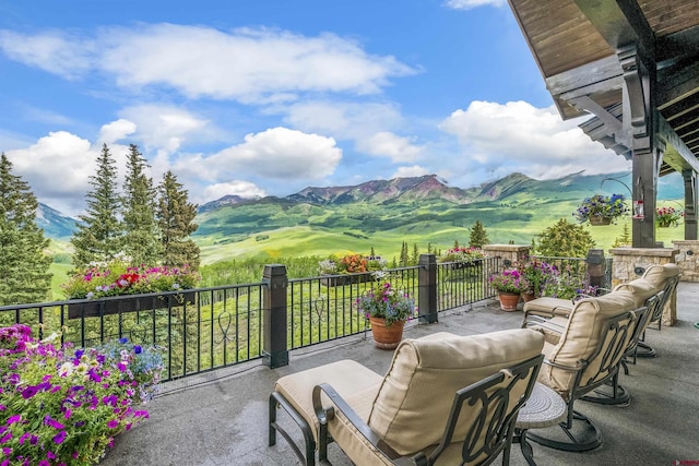 exterior space with a mountain view and a balcony