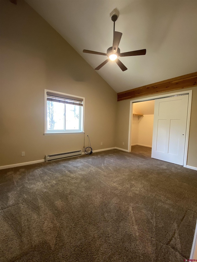 unfurnished bedroom with a baseboard heating unit, dark colored carpet, vaulted ceiling, ceiling fan, and a closet