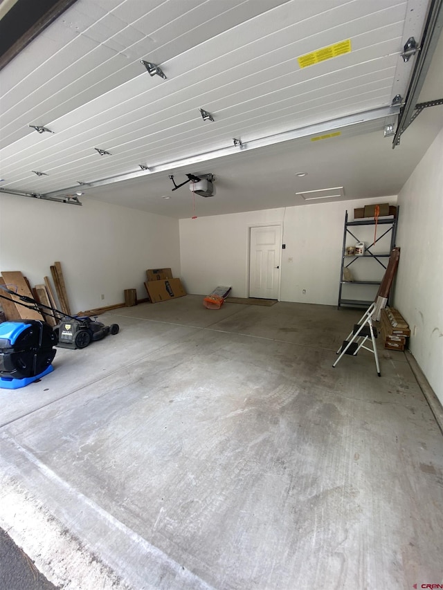 garage featuring a garage door opener