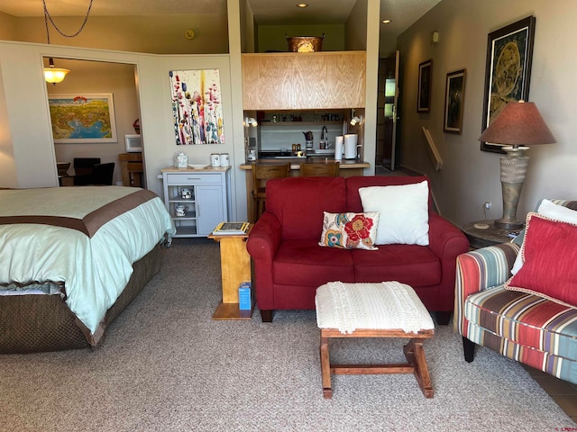 carpeted bedroom featuring sink