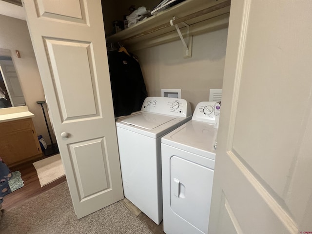 clothes washing area with laundry area and washing machine and clothes dryer