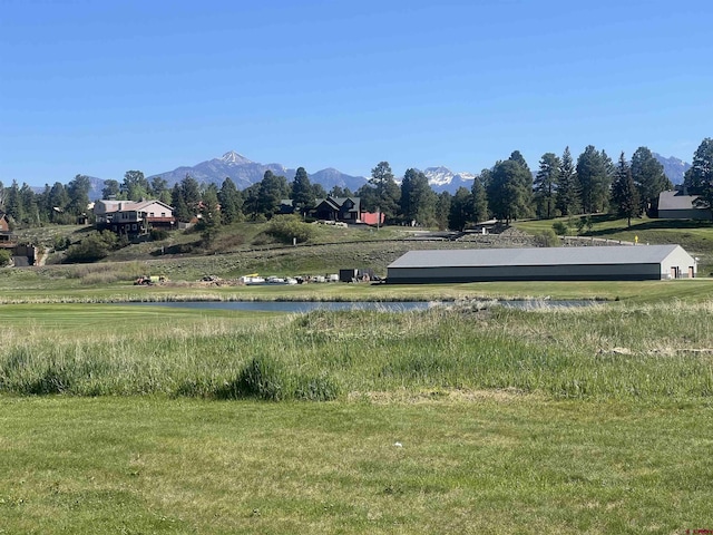 surrounding community featuring a rural view and a water and mountain view