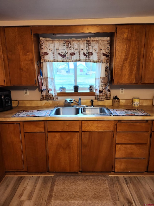 kitchen featuring light hardwood / wood-style floors and sink