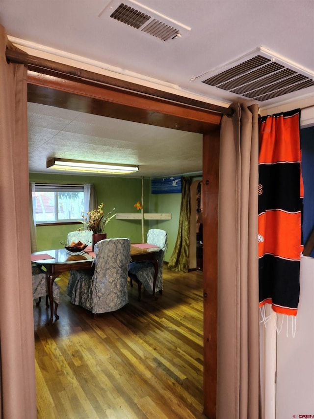 dining room with wood-type flooring