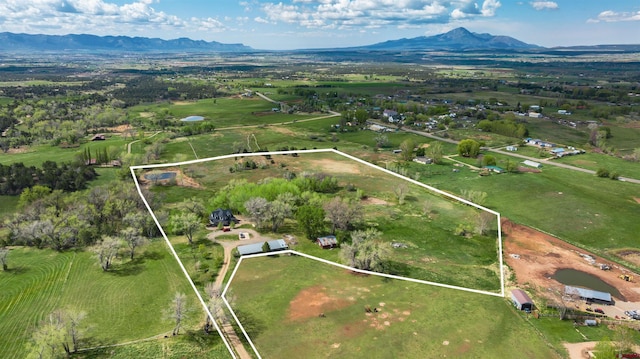 bird's eye view featuring a mountain view and a rural view