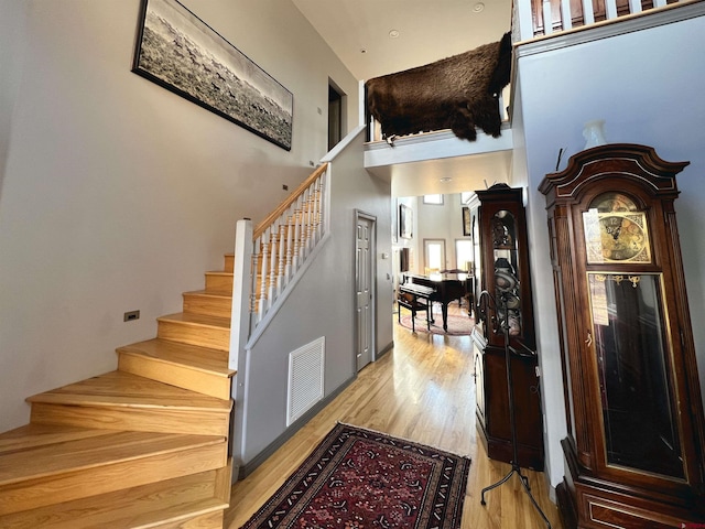 staircase featuring hardwood / wood-style flooring