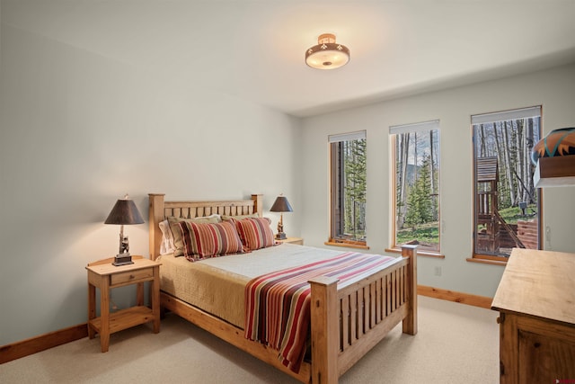 bedroom featuring light colored carpet