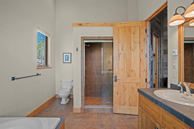 bathroom with vanity, toilet, and walk in shower