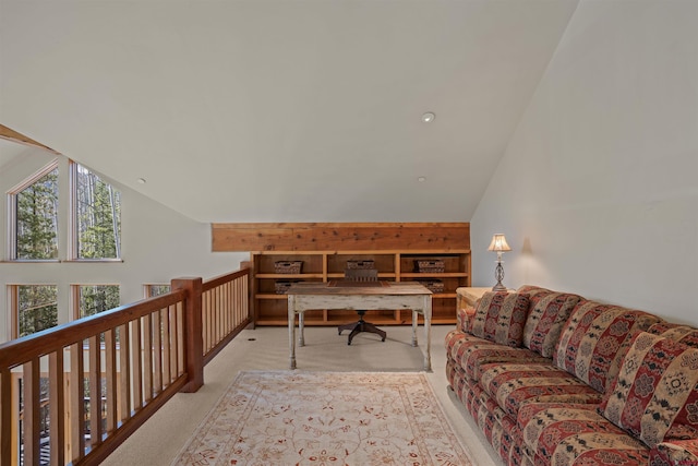 carpeted office with lofted ceiling